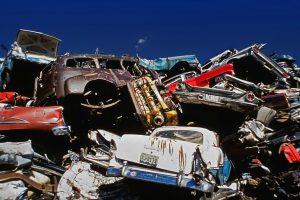 A vintage 1972 photograph of a junkyard full of scrapped cars, evocative of Sun Valley's Aadlen Brothers Auto Wrecking in its heyday Jose Mier